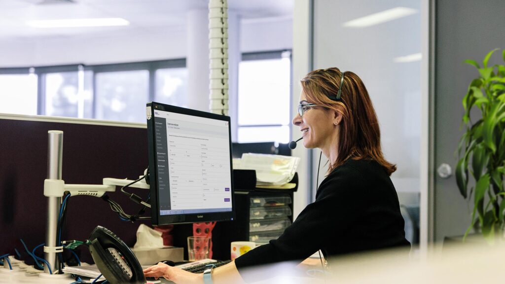 Female MAX Health nurse talking to patient customer on headset